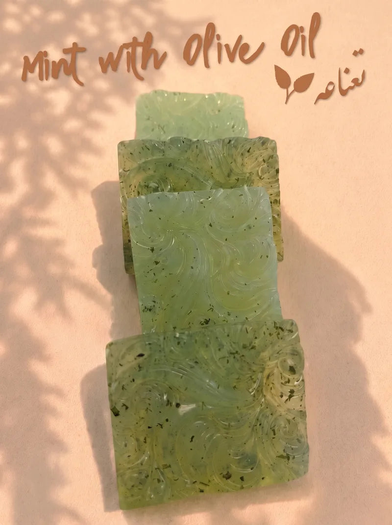 Green mint soap squares with dried mint flecks