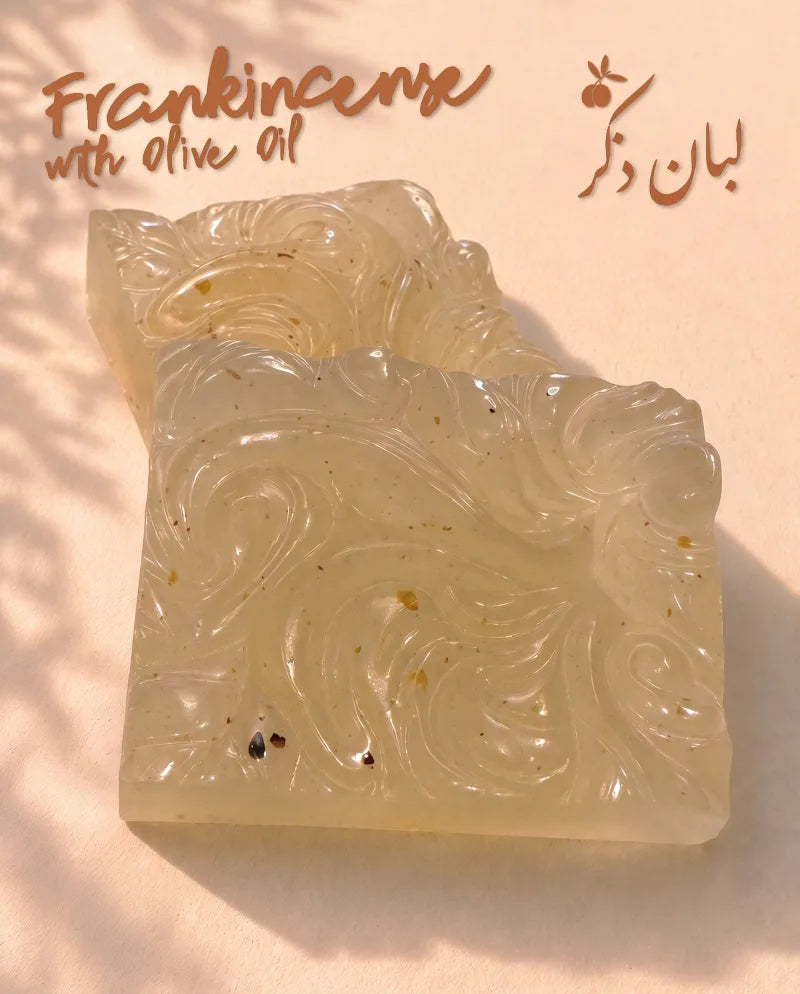 Hand-carved OLIVO frankincense soap squares showing the swirl pattern